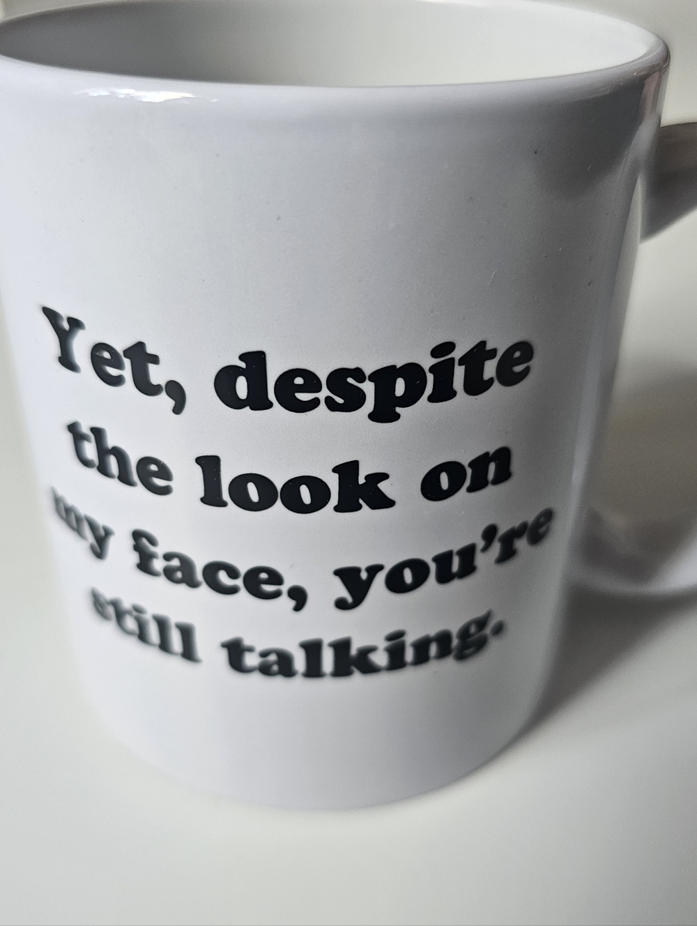 Yet, Despite The Look On My Face, You're Still Talking Cup Mug